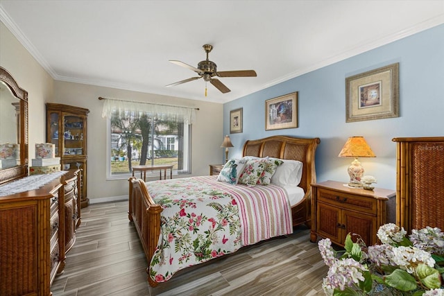 bedroom featuring ceiling fan and crown molding