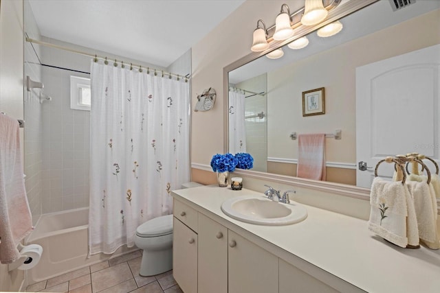 full bathroom with tile patterned flooring, shower / bath combination with curtain, toilet, and vanity