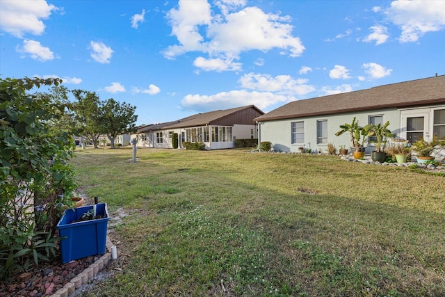 view of yard featuring a sunroom