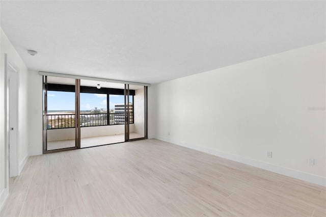 unfurnished room featuring light hardwood / wood-style flooring