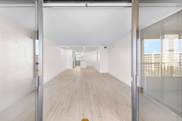 unfurnished room featuring light wood-type flooring