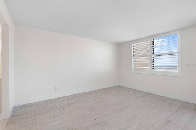 unfurnished room featuring light hardwood / wood-style floors