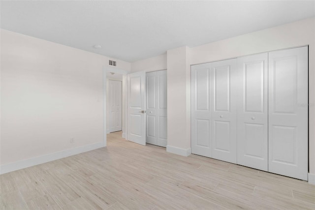 unfurnished bedroom featuring light hardwood / wood-style floors