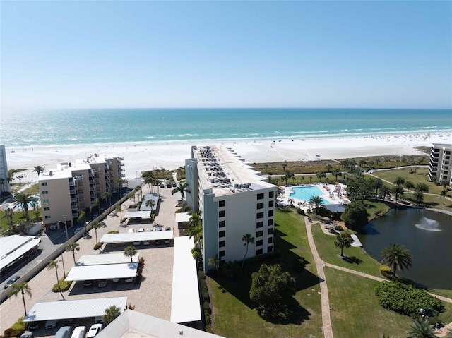 aerial view featuring a view of the beach and a water view