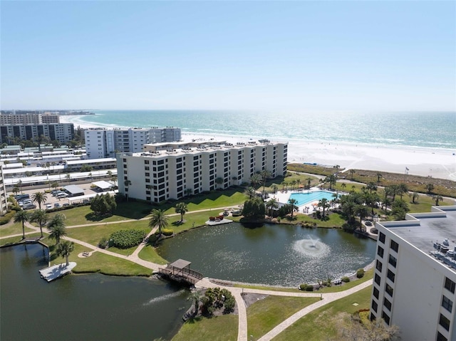 bird's eye view with a water view and a view of the beach