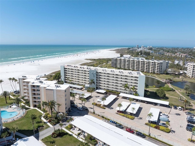 aerial view featuring a water view and a view of the beach