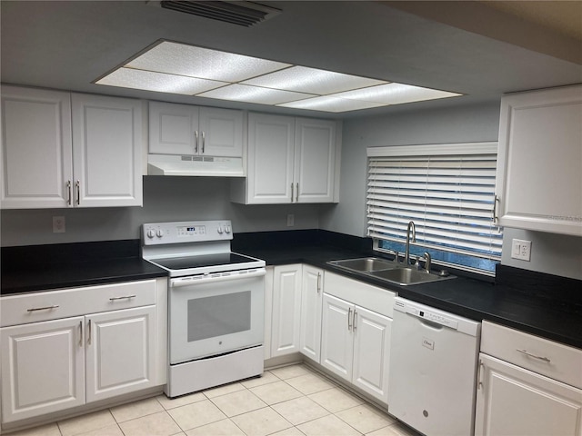 kitchen with light tile patterned floors, white appliances, white cabinetry, and sink