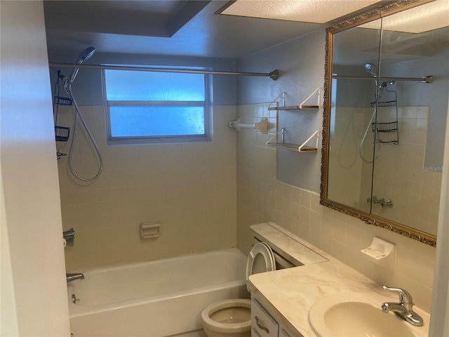 full bathroom with tiled shower / bath combo, backsplash, toilet, vanity, and tile walls