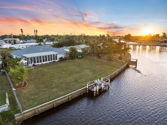 aerial view at dusk with a water view