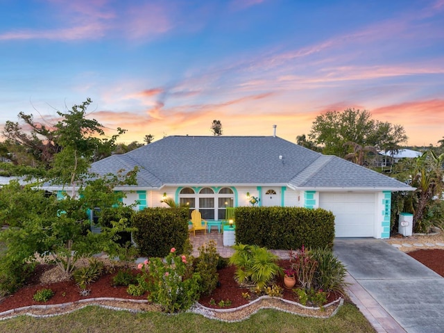 view of front of property with a garage