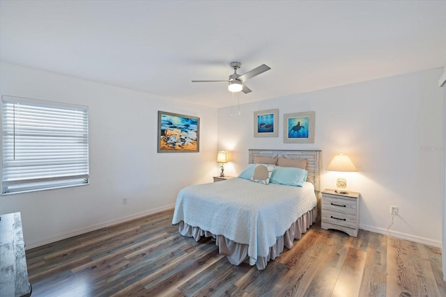 bedroom featuring ceiling fan and dark wood-type flooring