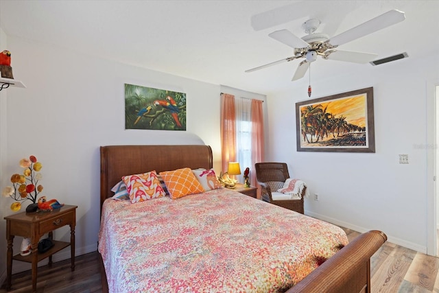 bedroom with hardwood / wood-style flooring and ceiling fan