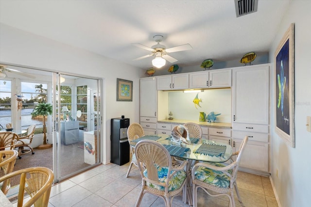 dining area featuring ceiling fan and light tile patterned floors