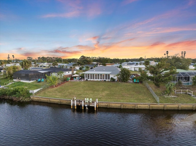 aerial view at dusk with a water view