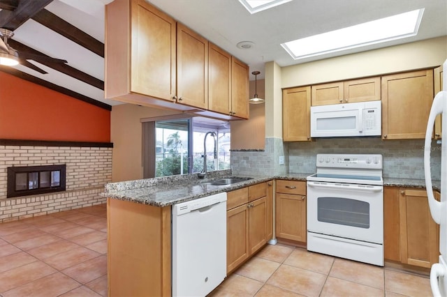 kitchen featuring white appliances, stone counters, sink, light tile patterned floors, and beam ceiling