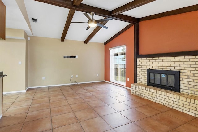 unfurnished living room with tile patterned floors, ceiling fan, a fireplace, and lofted ceiling with beams