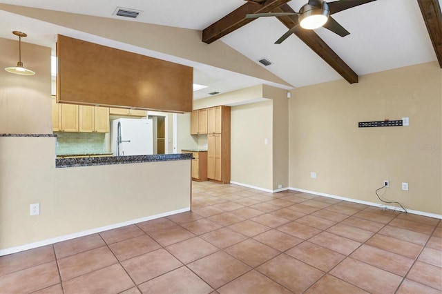 kitchen with ceiling fan, lofted ceiling with beams, white refrigerator, light brown cabinetry, and light tile patterned floors