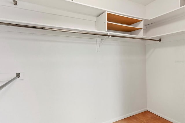 walk in closet featuring light tile patterned floors