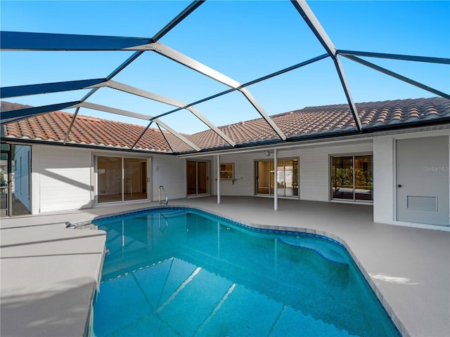 pool featuring a lanai and a patio area