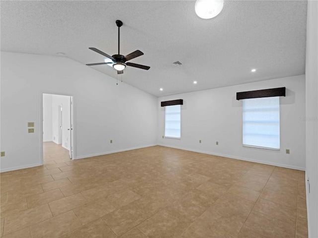 unfurnished room with a healthy amount of sunlight, a textured ceiling, visible vents, and a ceiling fan