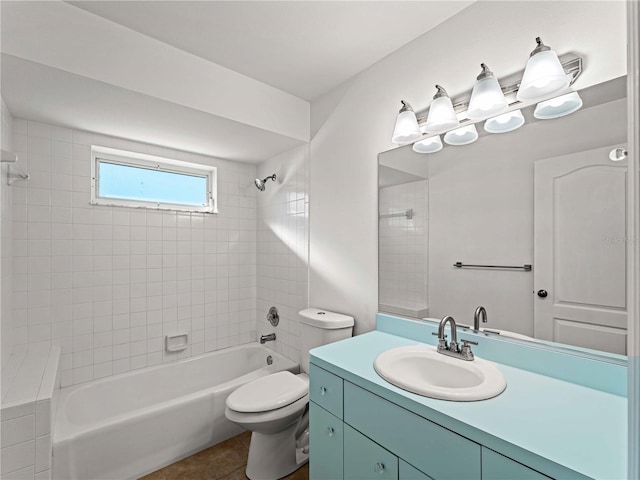 bathroom featuring toilet, tile patterned flooring, washtub / shower combination, and vanity