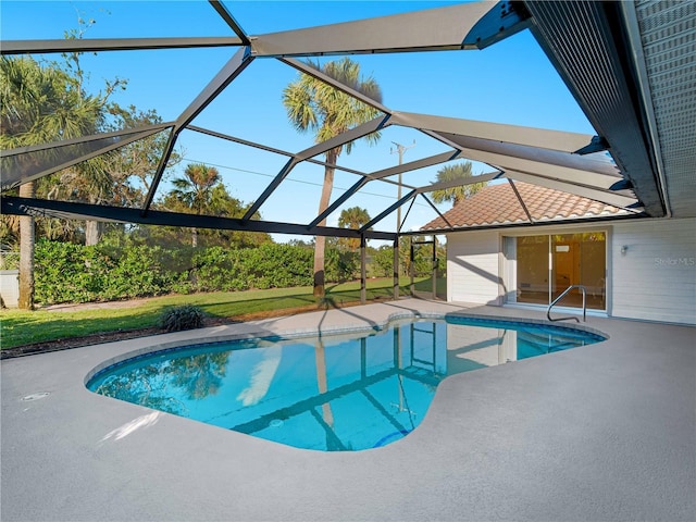 pool with a lanai and a patio