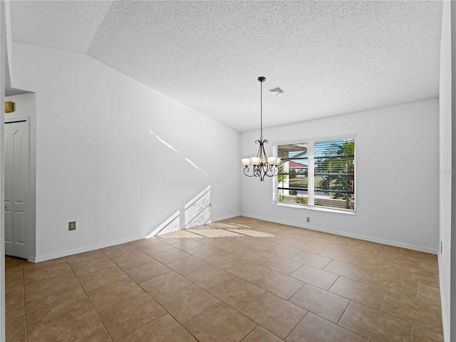 interior space with a chandelier, a textured ceiling, visible vents, and baseboards