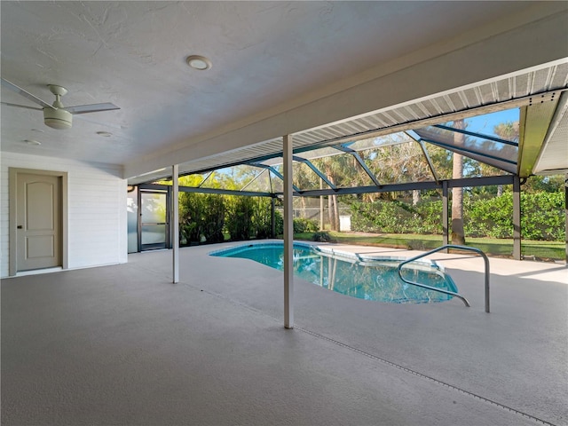 pool with a lanai, a patio, and ceiling fan