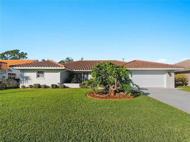 view of front of house featuring a garage, a tile roof, concrete driveway, stucco siding, and a front yard