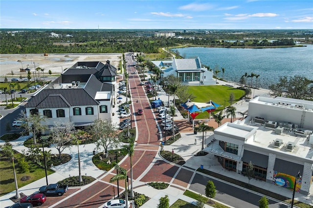 birds eye view of property with a water view