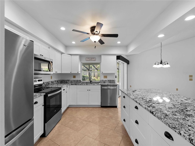 1678 Quail Lake Dr, Venice, FL 34293 - kitchen featuring appliances with stainless steel finishes, white cabinetry, ceiling fan, light stone counters, and recessed lighting