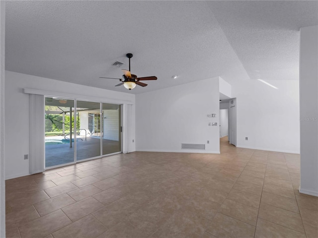 1678 Quail Lake Dr, Venice, FL 34293 - tiled spare room featuring a textured ceiling, a ceiling fan, baseboards, and lofted ceiling