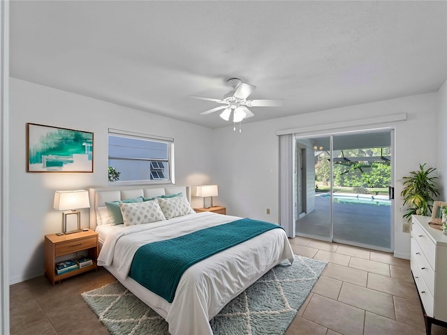 1678 Quail Lake Dr, Venice, FL 34293 - bedroom featuring access to outside, light tile patterned floors, ceiling fan, and baseboards