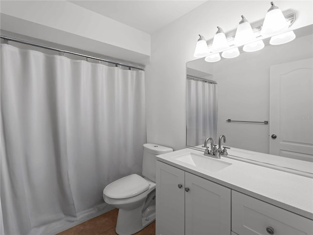 1678 Quail Lake Dr, Venice, FL 34293 - bathroom featuring vanity, tile patterned floors, and toilet