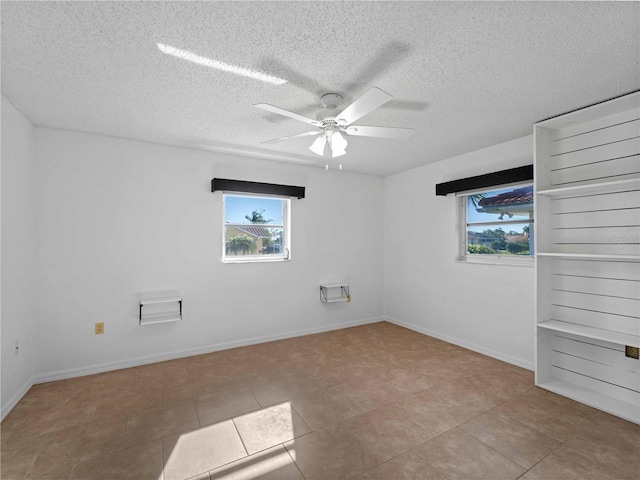 1678 Quail Lake Dr, Venice, FL 34293 - tiled empty room featuring healthy amount of natural light, ceiling fan, a textured ceiling, and baseboards