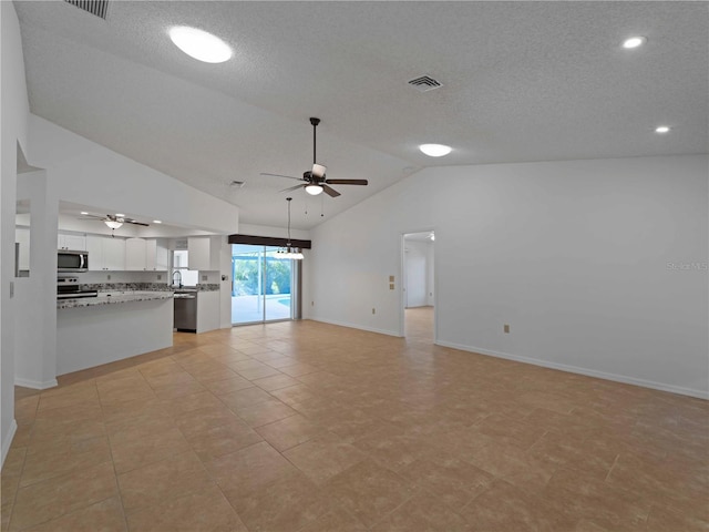 1678 Quail Lake Dr, Venice, FL 34293 - unfurnished living room with a ceiling fan, lofted ceiling, baseboards, recessed lighting, and a textured ceiling