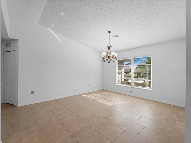 1678 Quail Lake Dr, Venice, FL 34293 - spare room featuring a textured ceiling, a chandelier, light tile patterned flooring, vaulted ceiling, and baseboards