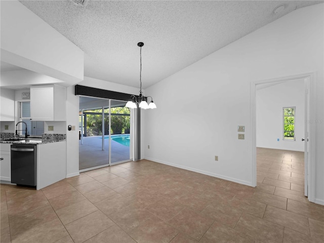 1678 Quail Lake Dr, Venice, FL 34293 - unfurnished dining area with a textured ceiling, a sink, baseboards, light tile patterned floors, and a chandelier