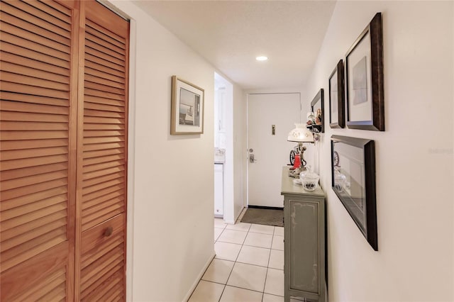 corridor featuring light tile patterned floors