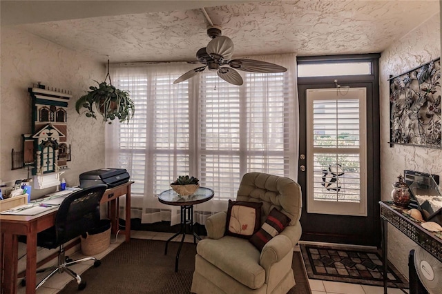 tiled home office featuring ceiling fan