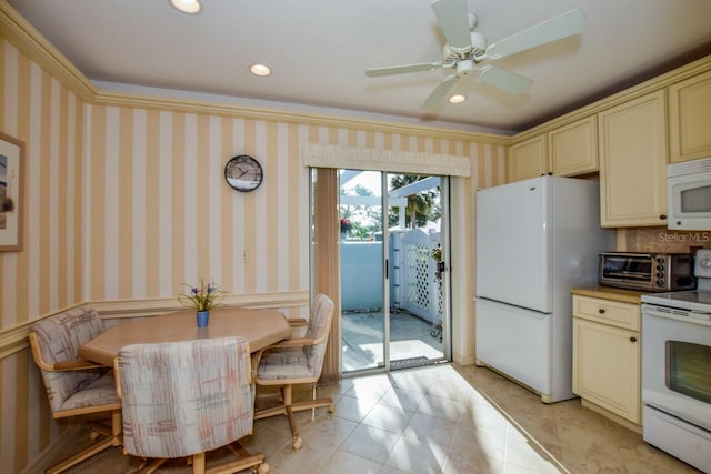 kitchen with crown molding, ceiling fan, white appliances, and cream cabinetry