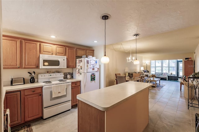 kitchen featuring pendant lighting, a center island, white appliances, light tile patterned floors, and a notable chandelier