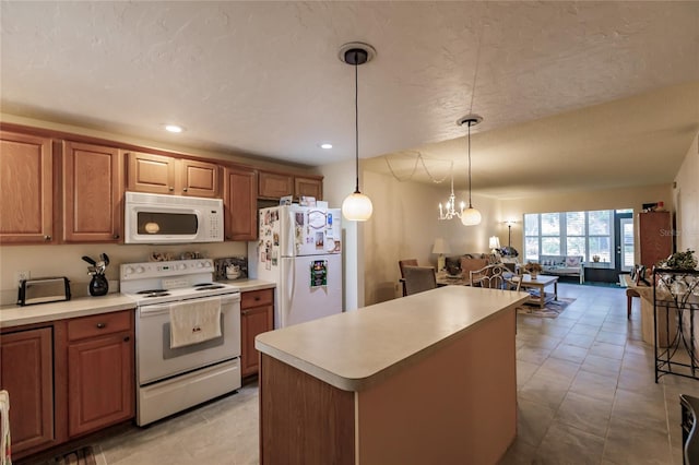 kitchen with a center island, white appliances, hanging light fixtures, a textured ceiling, and a notable chandelier