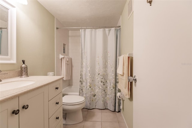 full bathroom with vanity, a textured ceiling, shower / bathtub combination with curtain, tile patterned flooring, and toilet