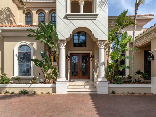 property entrance featuring french doors