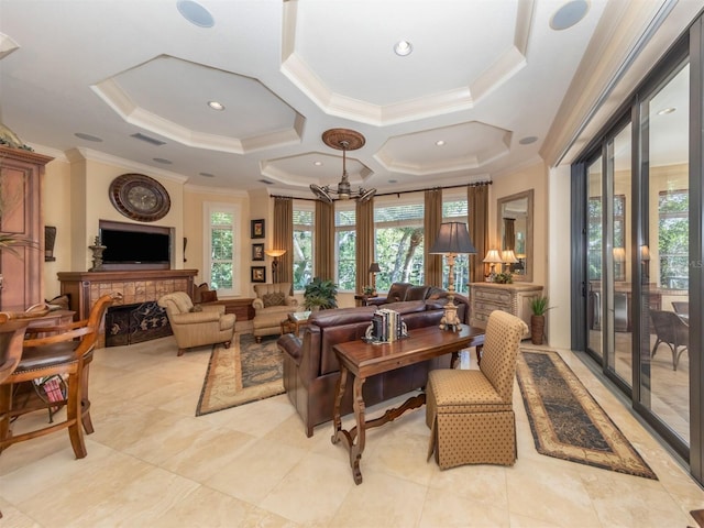 living room with ornamental molding and coffered ceiling