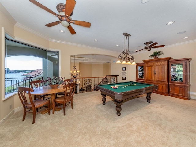 playroom featuring light carpet, ceiling fan with notable chandelier, a water view, ornamental molding, and pool table