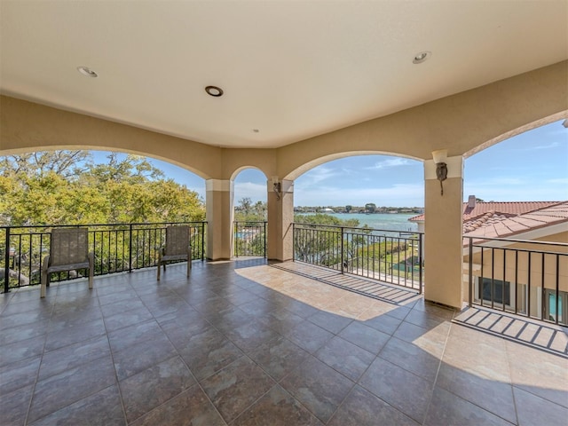 view of patio featuring a water view