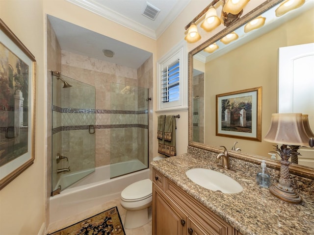 full bathroom featuring tile patterned floors, vanity, crown molding, enclosed tub / shower combo, and toilet