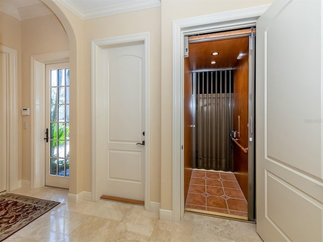 doorway to outside featuring ornamental molding